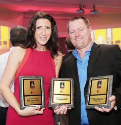 Shona McGill and Corey Blohm display the three awards won by The Brasserie: Best Place for Lunch, Restaurant of the Year and Best Farm to Table Restaurant.
