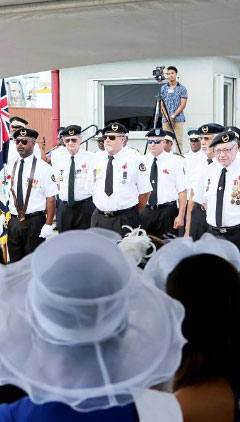 Members of the Cayman Islands Veterans Association stand at attention during Remembrance Day events.