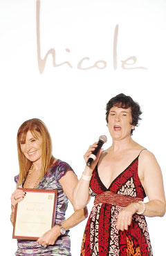 Nicole Miller, left, is recognized by the visiting CEO of 100 Women in Hedge Funds, Amanda Pullinger.
