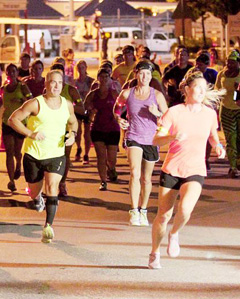 The inaugural Run in the Dark race in downtown George Town had a good turnout. – PHOTOS: RON SHILLINGFORD