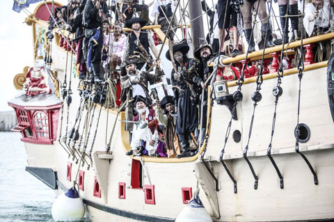 The Jolly Roger, packed with pirates, gets ready to make its landing. – PHOTO: STEPHEN CLARKE