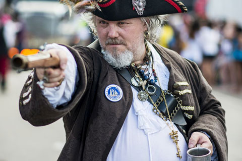 Taking aim: Armed with his pistol, this pirate is ready to take over George Town. - PHOTO: TANEOS RAMSAY