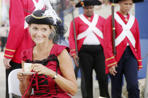 Governor Helen Kilpatrick enjoys a cup of tea before the pirates land in George Town. – PHOTO: STEPHEN CLARKE