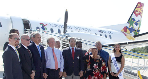 Government and airline officials welcome the new plane as it arrives on the Brac.