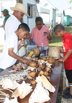 Checking out a craft stall at West Bay Heritage Day. - Photo: Chris Court