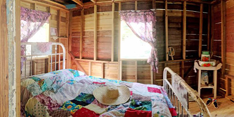 Aunt Cora’s cottage was decorated as an old-time home, complete with authentic touches like a plantain trash bed. – Photo: Eugenio Myles