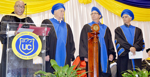 UCCI orator, Livingston Smith, presents honorary doctorates to Granville Burns Rutty, Heber Arch and Henry Muttoo at the October commencement ceremony.