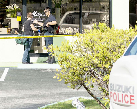 Police and scenes of crime officers investigate Wednesday