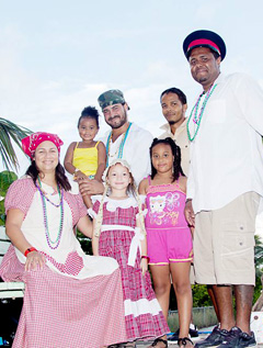 Annikki Brown, Leighla Whittaker, Andrew Rivers, Myllie Bush, Kayla Jennings, Reuben Ebanks, and Marco Whittaker on the Bodden Town float at the Pirates Week 2015 parade last Saturday.