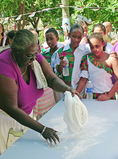 Rose Myles makes peppermint candy at a past Bodden Town heritage day.