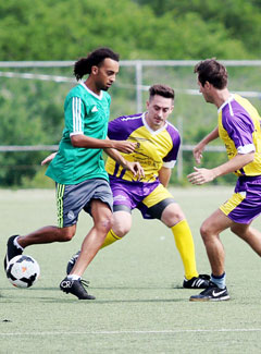 Forde Pierson, left, scored for Harry’s. - PHOTOS: RON SHILLINGFORD