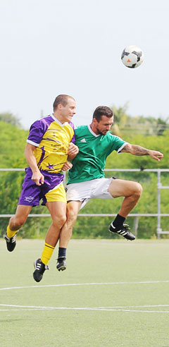 Graham Blyth, left, of Whiskey Mist and Jaz Muratagic of Harry’s challenge for the ball.
