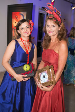 Natalie Urquhart, director of the gallery, and Governor Helen Kilpatrick join in the surrealist theme of the 2014 gala.
