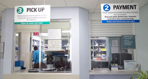 The pick-up window at the pharmacy in Cayman Islands Hospital. From January next year, patients will be required to pay for prescriptions upfront. - Photo: Kelsey Jukam