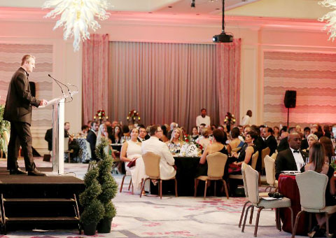 Nicholas Butcher speaks about Hedge Funds Care Cayman during the ‘Open Your Heart to the Children’ benefit on Saturday night. – Photo: Maggie Jackson