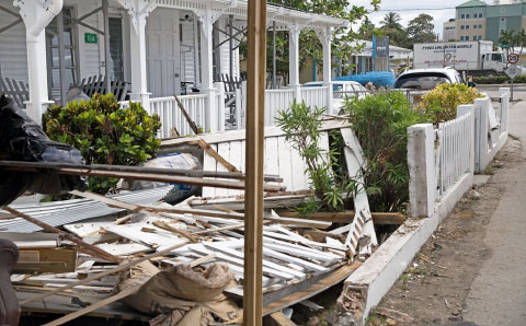 The old print shop and the fence at the Arthur Bodden house were wrecked in the crash. - PHOTO: KELSEY JUKAM