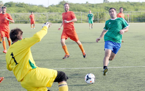 Luciano De Riso of Harry’s is thwarted by Luca keeper Shane Connolly. - PHOTOS: RON SHILLINGFORD