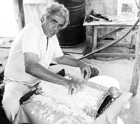 Clare Woodman Bears, better known as ‘Panama,’ grates coconuts.  - Photo: George Nowak