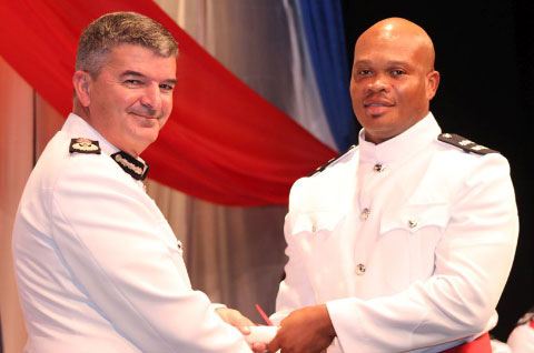 PC Dave Barnett, who was awarded Best Overall Student accolade, receives his police certificate from Commissioner David Baines. -Photo: Jewel Levy