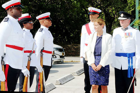 Governor Helen Kilpatrick inspects new officers in the company of Police Commissioner David Baines and training officer PC Gabe Rabess. - Photo: Jewel Levy