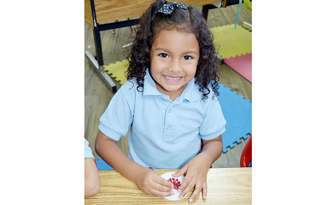 Alison Hernandez-Pavon creates a Christmas decoration.
