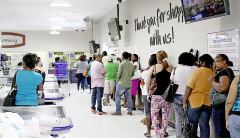 People stood in line for hours Monday to send money by Western Union