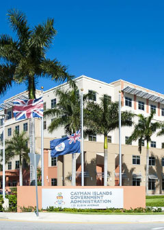 The Cayman Islands flag flies at half mast on Monday outside the Government Administration Building in honor of Julia Hydes.