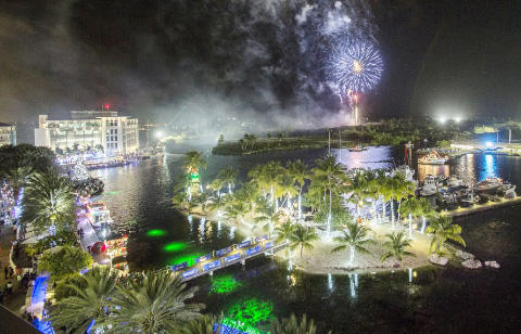 Fireworks light up the sky as gaily decorated boats delight spectators during the annual Parade of Lights at Camana Bay on Saturday night. - PHOTO: STEPHEN CLARKE