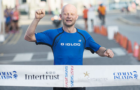 Marathon winner Pawel Kaszyca from Poland crosses the finish line Sunday morning. - PHOTO: TANEOS RAMSAY