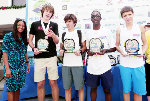 The MDR Boat Builders were the first-place relay team. Annick Jackman, left, with the Department of Tourism, joins relay winners Dominic Dyer, William Edwards, Delano Callender and Victor Magalhaes.