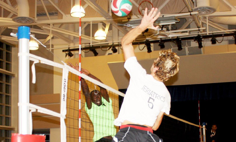 Allen Grunert of Jeriatrics faces a big block by Keeble Knight.