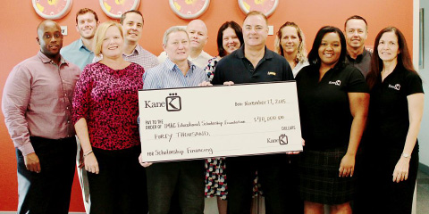 Linda Haddleton, managing director of Kane (Cayman) Ltd. and director of the IMAC Educational Scholarship Foundation, with members of the Kane team