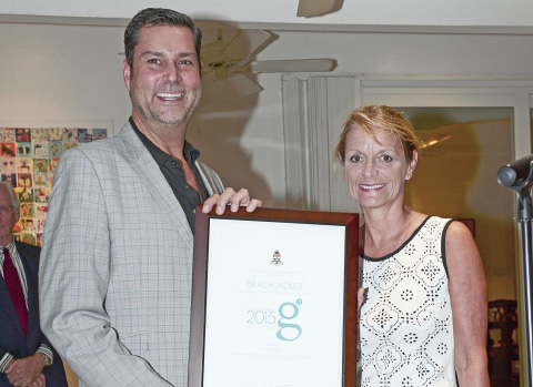 Governor Helen Kilpatrick presents Raoul Pal, owner of the Little Cayman Beach House, with the 2015 Governor