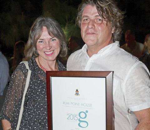 Lisa and Vidal Brewer with the design award for their Rum Point House. - PHOTO: DAVID R. LEGGE
