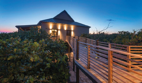 The Little Cayman home features three distinct buildings connected by wooden bridges. - PHOTO: MONIKA WOJTKIEWICZ, COURTESY OF REALLIFE MAGAZINE