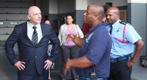 Newly appointed Chief Fire Officer David Hails, left, speaks with Lead Fire Officer Mitchell Connor, center, and Acting Senior Division Officer Wayne Ebanks on Wednesday at West Bay Fire Station.