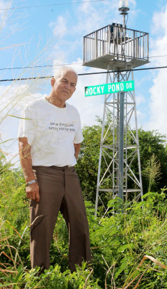 Rupert Ebanks stands on the spot in West Bay where the first beacon was erected, just across the road from the new one. - Photo: Jewel Levy
