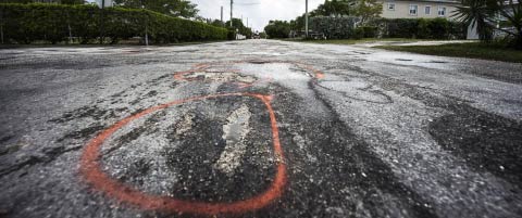 The National Roads Authority has marked locations of potholes along Selkirk Drive. – PHOTO: TANEOS RAMSAY