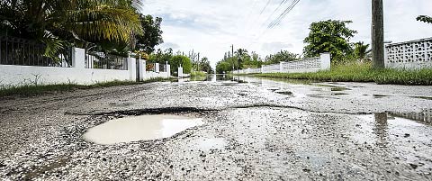 Residents living on Abbey Way, above, and nearby Selkirk Drive in Red Bay have repeatedly complained to the National Roads Authority about the potholes and flooding in the area. – PHOTO: TANEOS RAMSAY