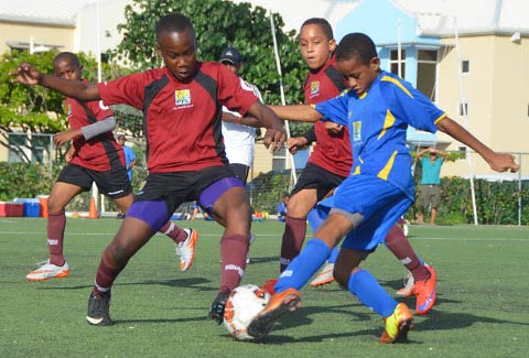 Red Bay’s Bradley Erskine tackles Joshua Gardner from Savannah Primary in the PFL Under-11 Champions Cup game.