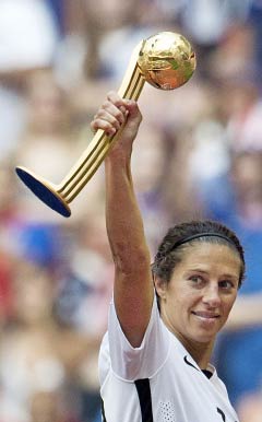 Carli Lloyd holds aloft the FIFA Women’s World Cup trophy in July after the United States beat Japan in the final in Vancouver, Canada. - PHOTO: AP