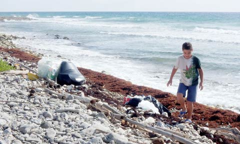 Kenny Ryan helped clean the beach. – Photo: Kathleen Bodden-Harris
