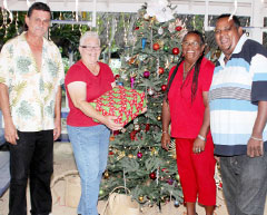 Christiana Edwards, second from right, with her son Mathew McLaughlin, receives her prize from Florence Wood, cultural committee president, and member Emilio Watler. - Photos: Jewel Levy
