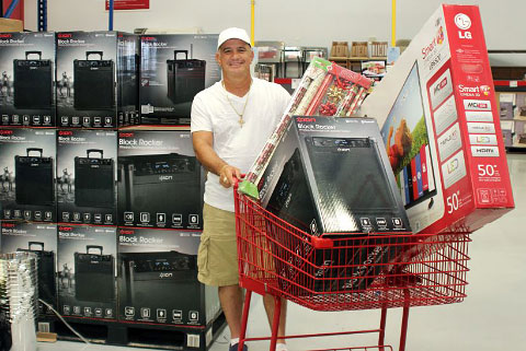 Shopper Antolin Lopez picks up some hot ticket Christmas items at Priced Right. – Photos: Jewel Levy