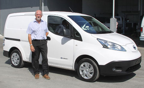 Jon Harvey, a representative of Cayman Automotive, delivered the electric vehicle to the Department of Vehicle and Equipment Services on Thursday. - Photo: Kelsey Jukam