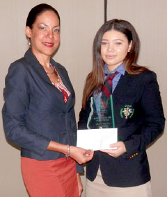 CITA Executive Director Tiffany Dixon-Ebanks presents a check to the new tourism ambassador, Justyce Rivers.