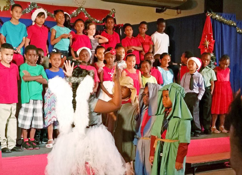 At the Infants concert, the Angel Gabriel tells the shepherds the good news.