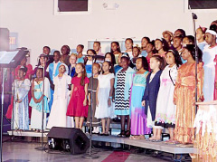 The choir performs at the junior concert.