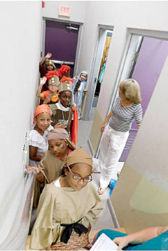 Members of the infant show cast waiting in the wings.