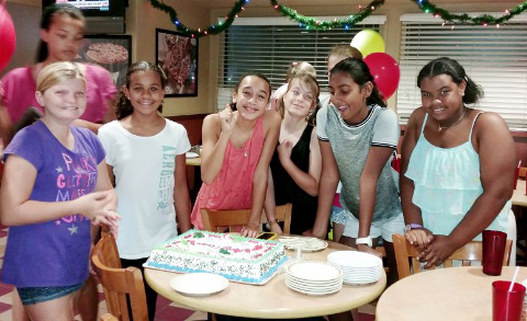 Nadia Simmonds, fourth from left, at her recent Christmas party.